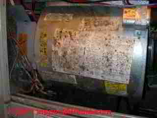 Photo of mold on the air conditionre blower assembly labels - right in the air path(C) Daniel Friedman